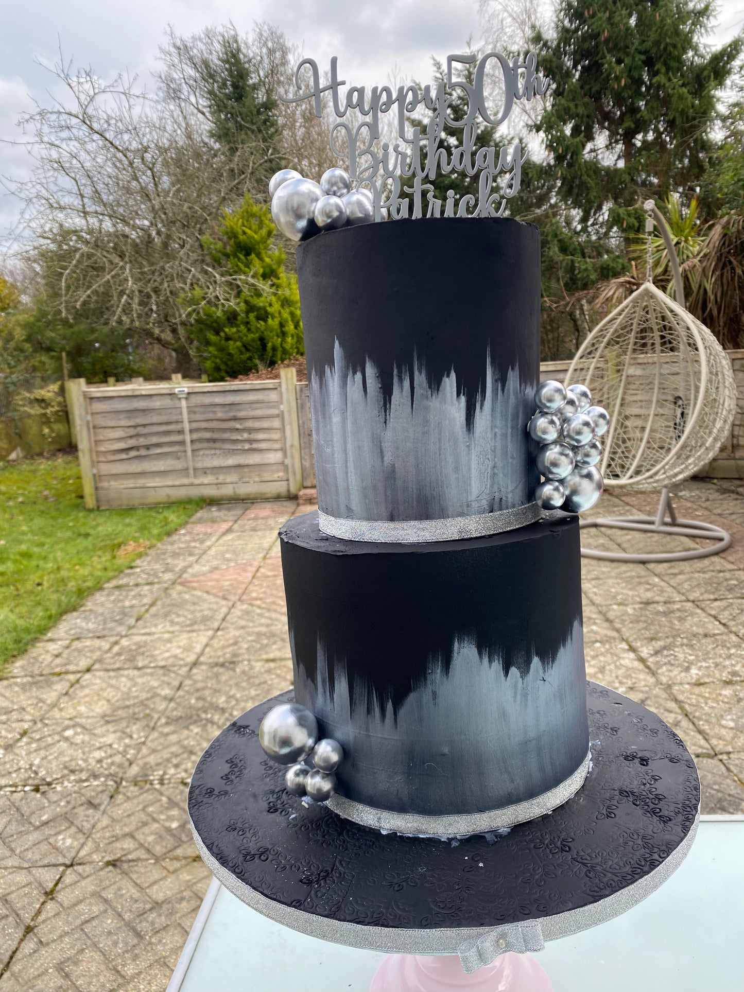 Black cake with silver accents
