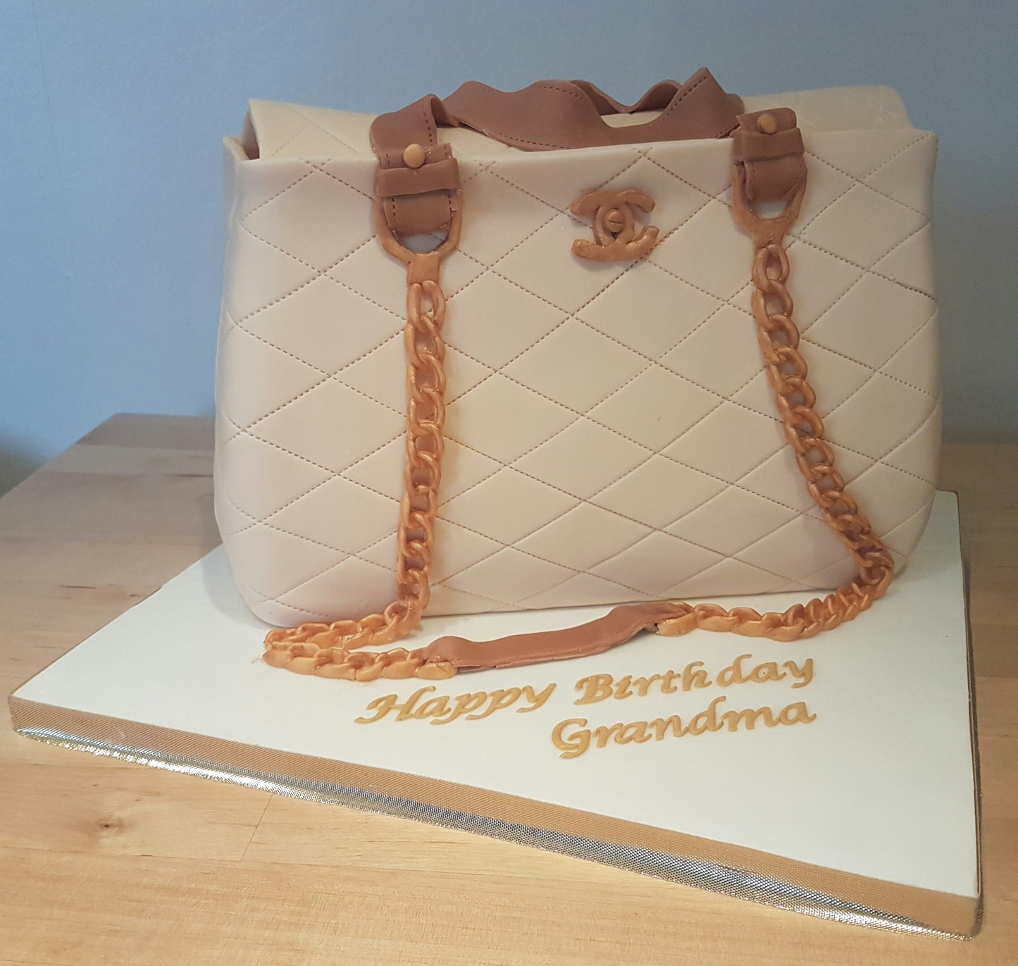 Cream Chanel bag cake