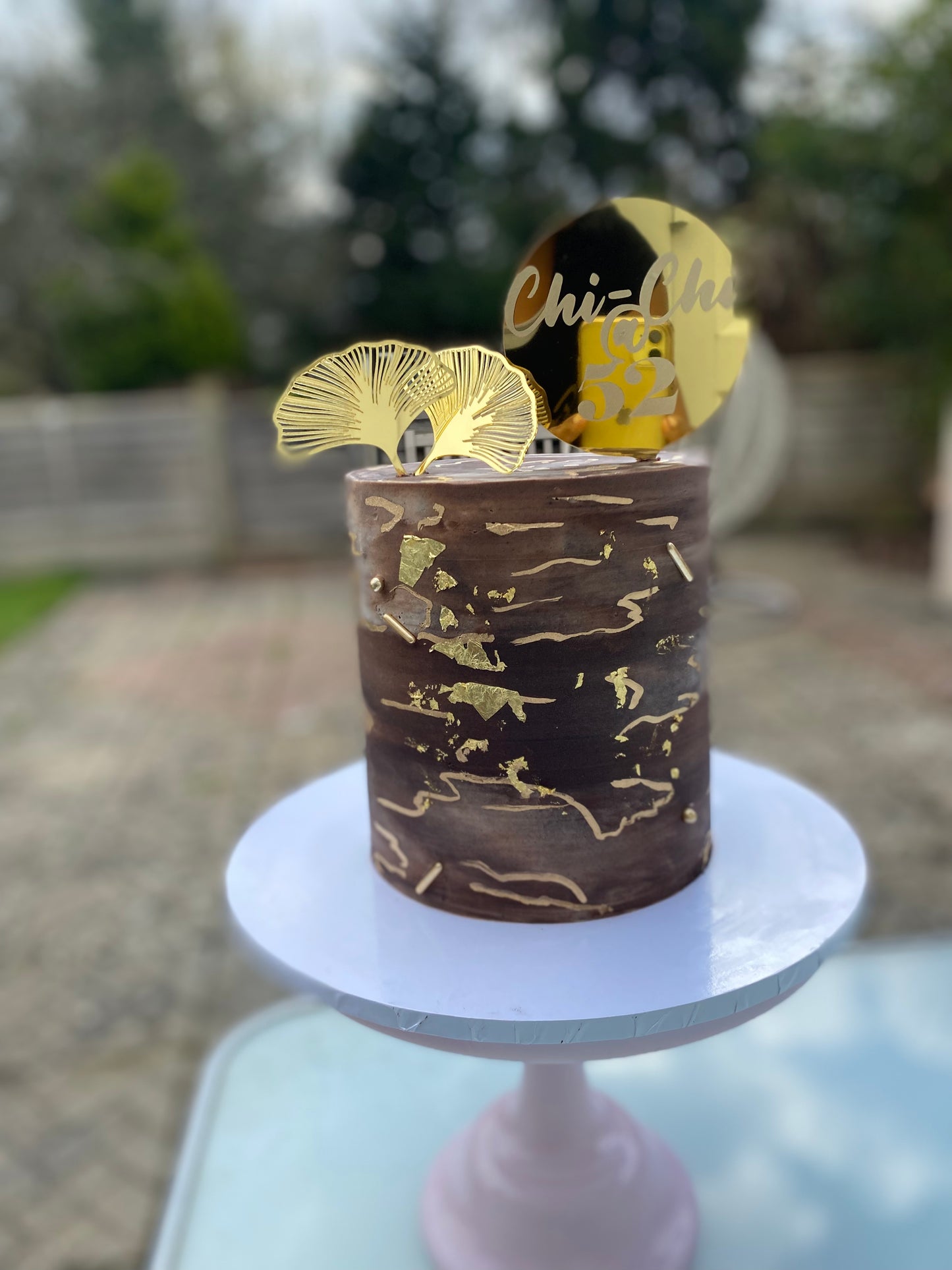 Chocolate brown and gold marble effect buttercream cake