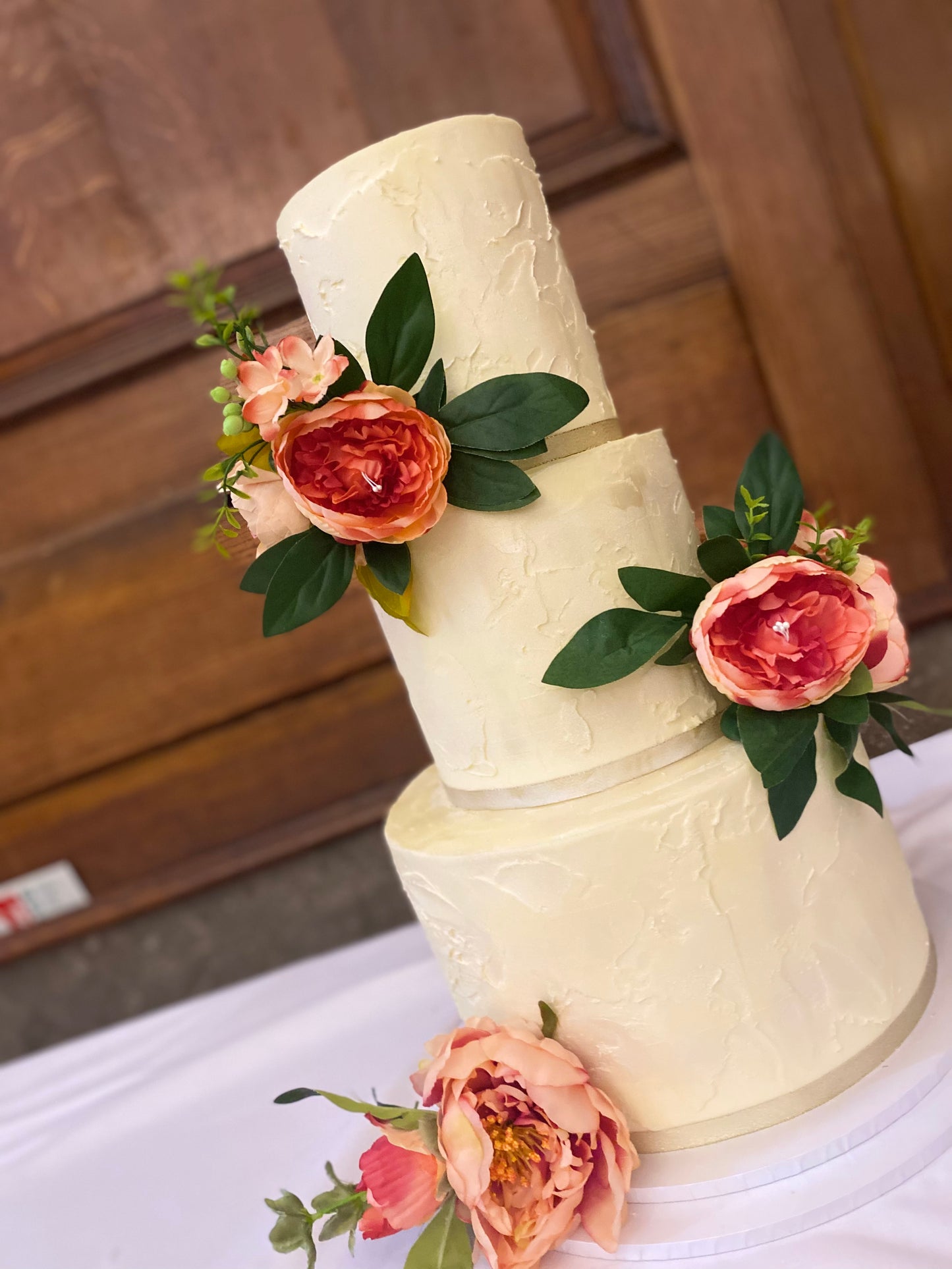 Three-tier rustic buttercream wedding cake