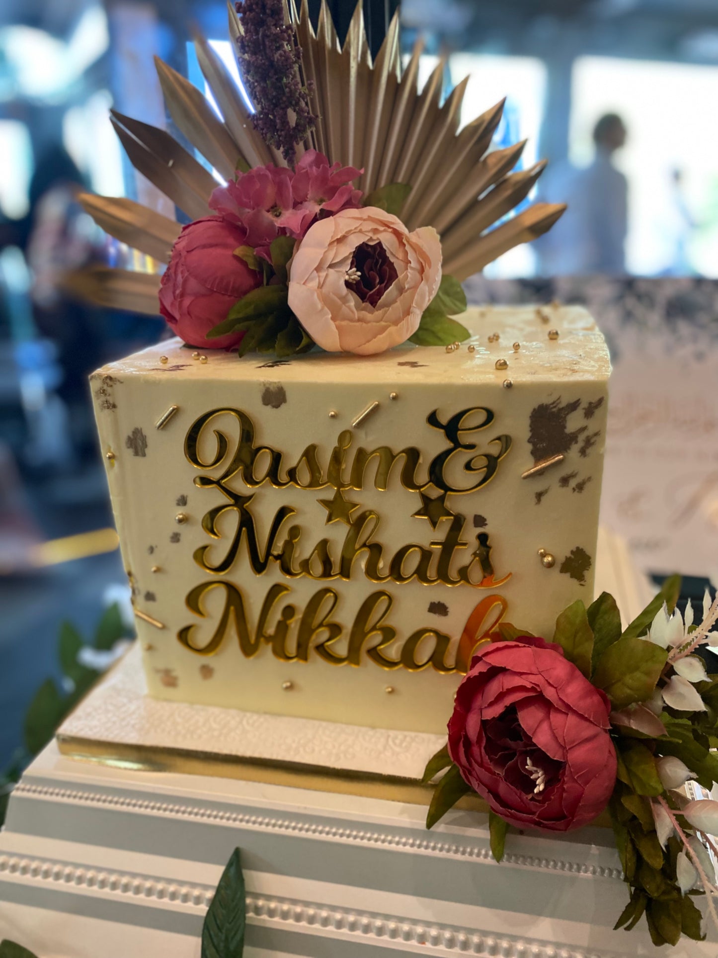 Square buttercream cake with name charm and flowers