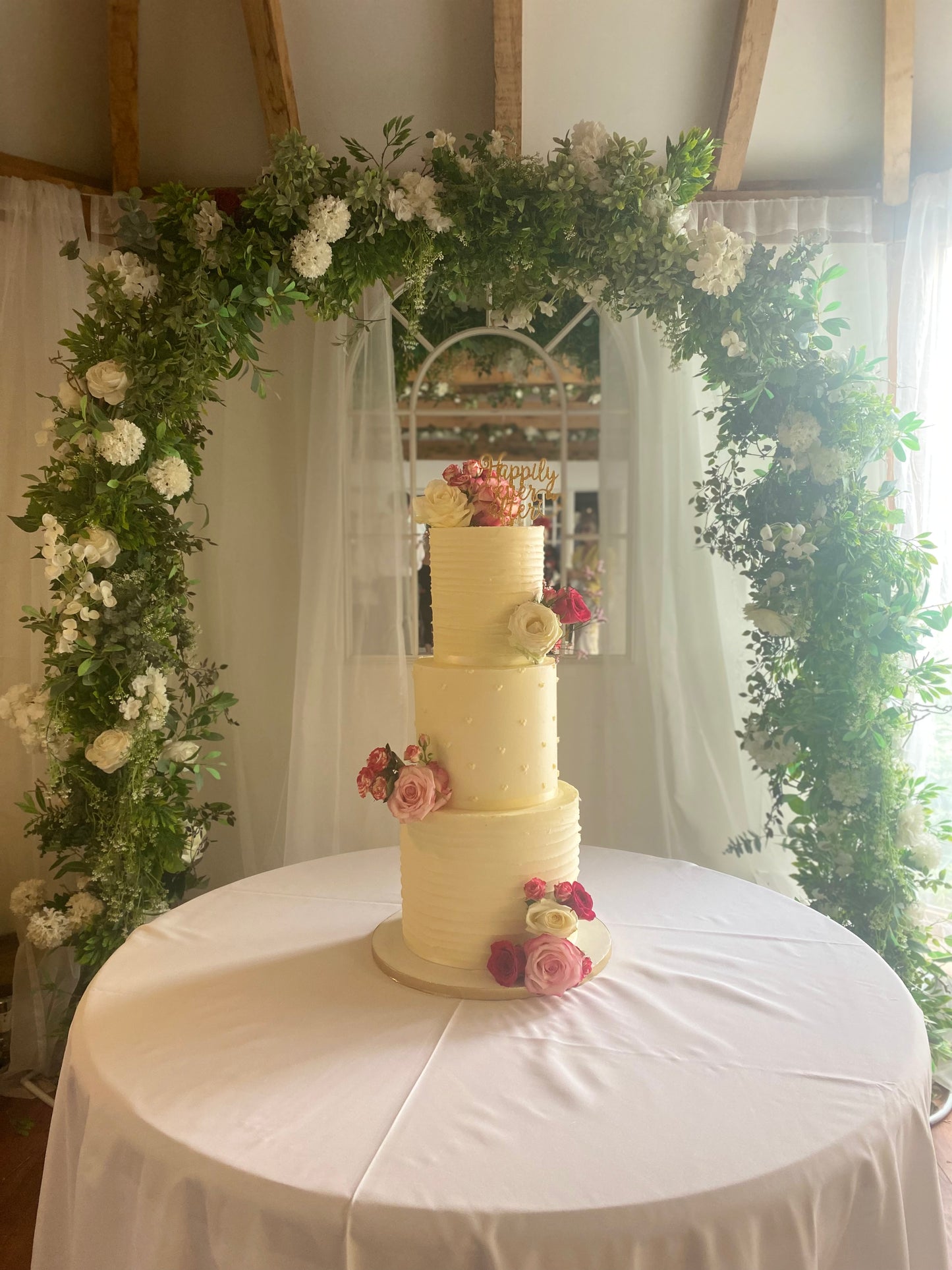 Three-tier buttercream wedding cake