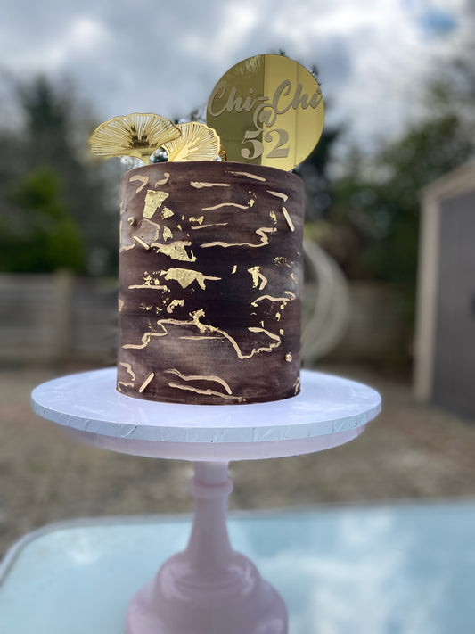 Chocolate brown and gold marble effect buttercream cake
