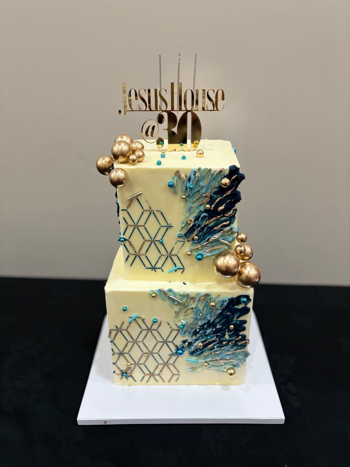Blue square 2-tier buttercream cake with abstract design