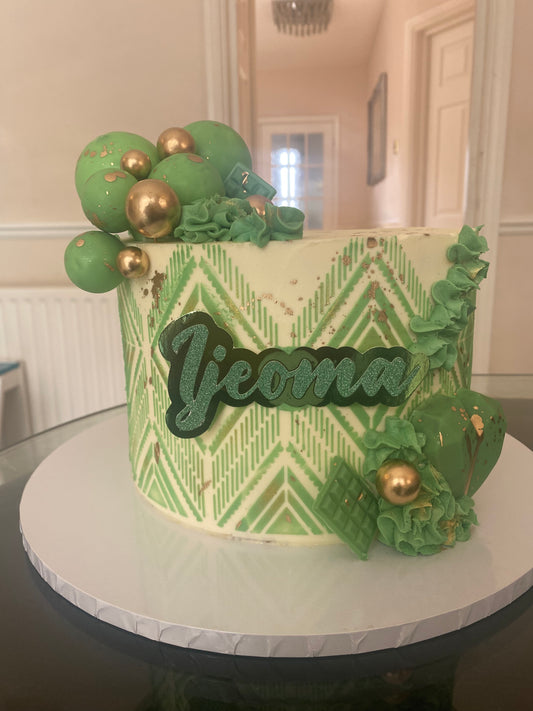 Cream cake with green stencil