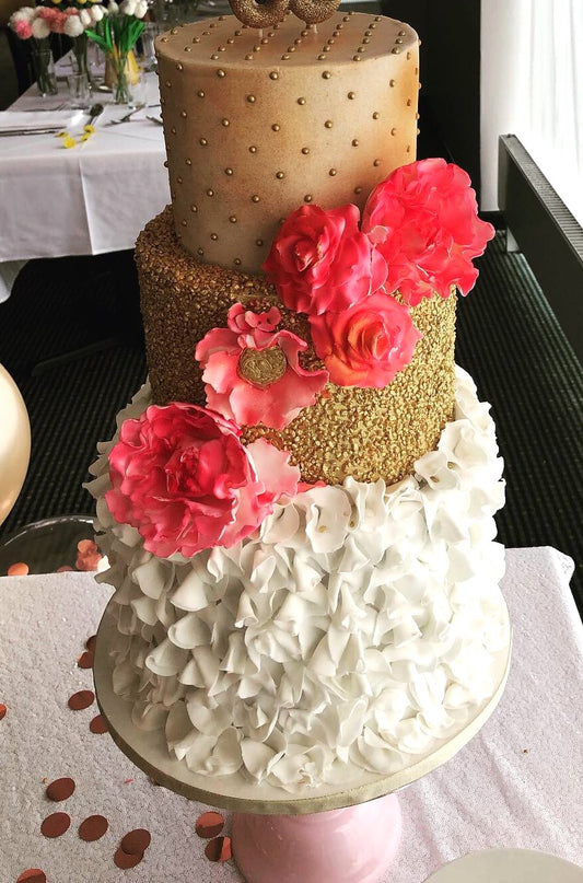 Three tier studded wedding cake