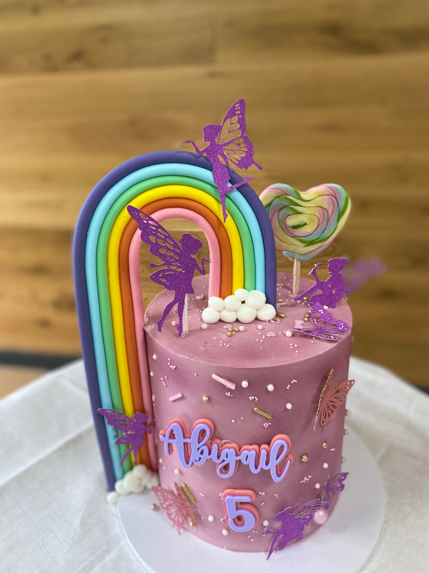 Butterflies, fairies and rainbow buttercream cake